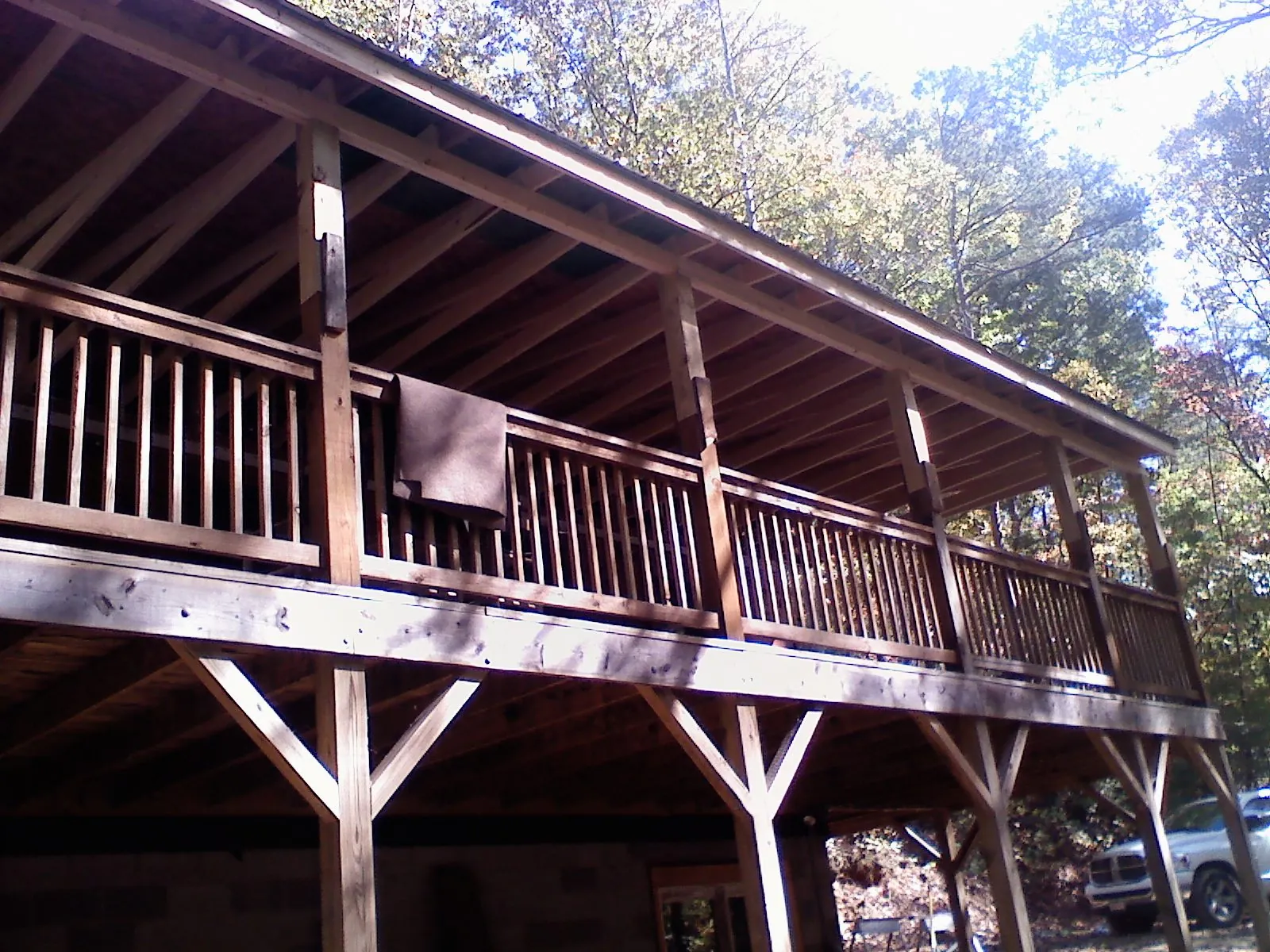 Timber framing under a new elevated porch and deck — Roof Leak Repair in Pebble Beach by Roofing Brothers